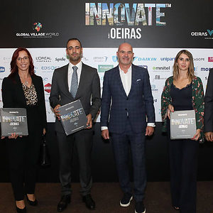 2 women and 2 men standing side by side, in front of banner at "Innovate Oeiras Launch"