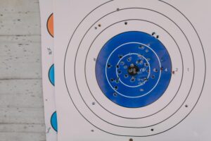 Shooting target with many bullet holes.