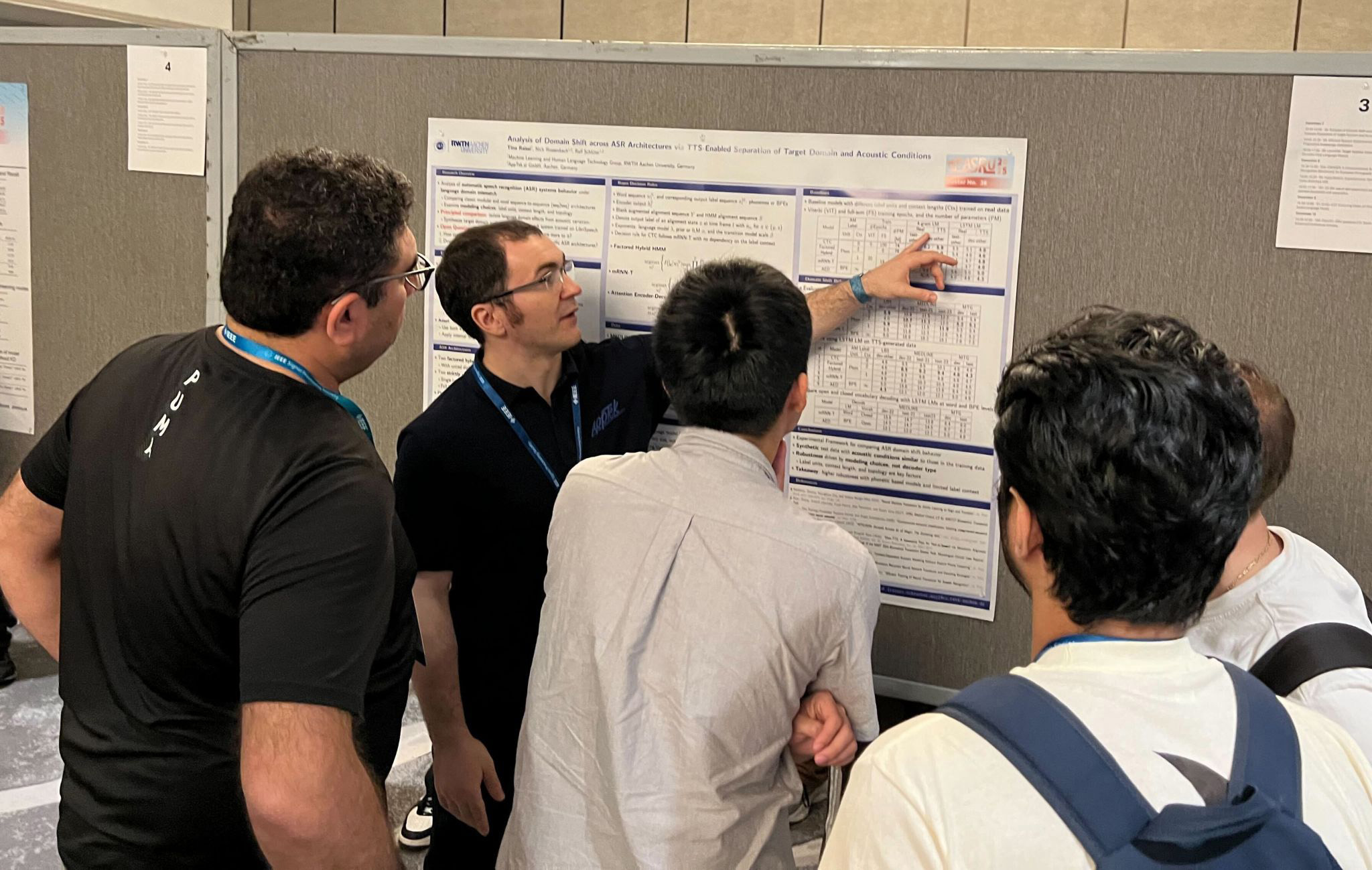 AppTek researchers at science board