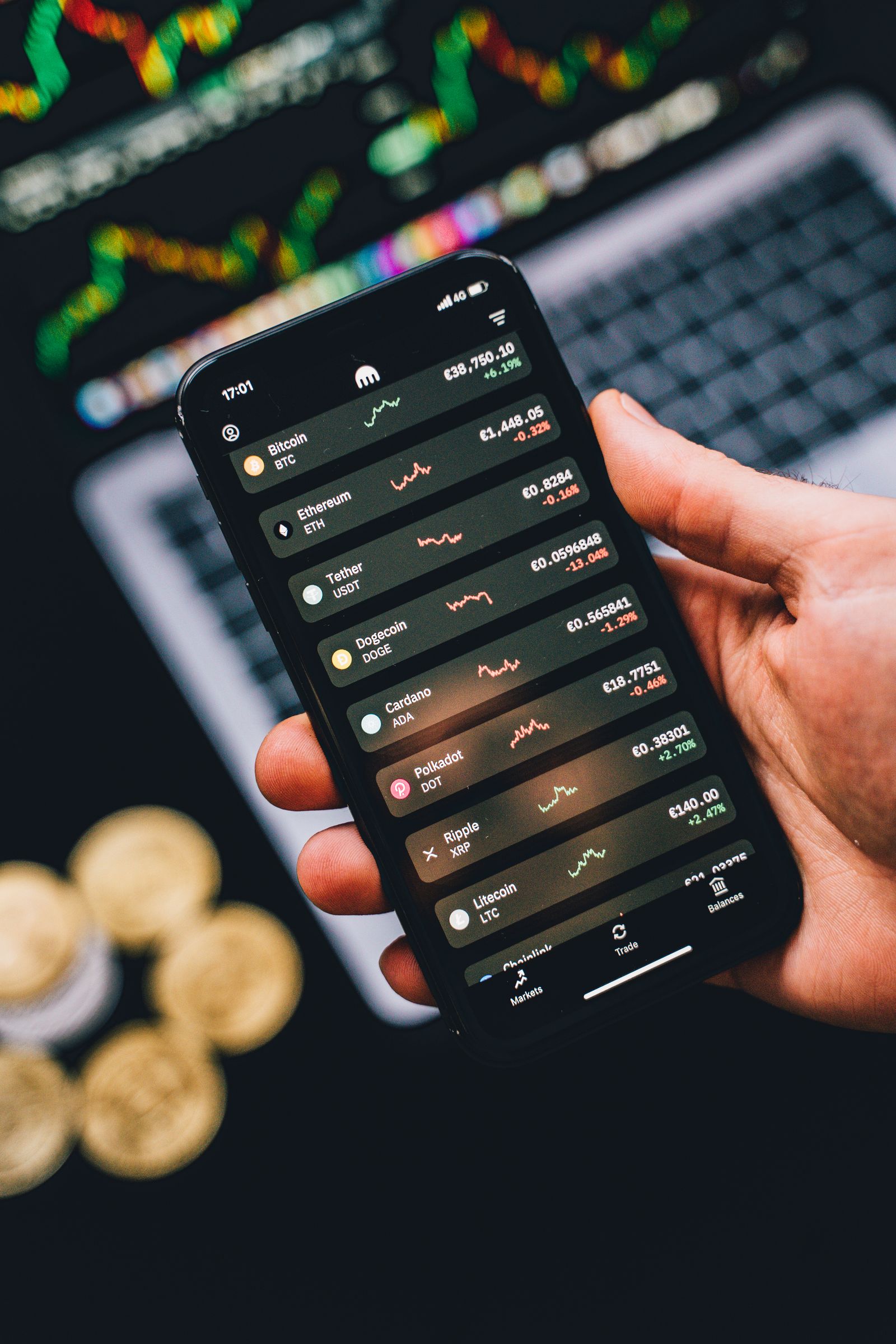 Hand holding a phone showing a cryptocurrency portfolio