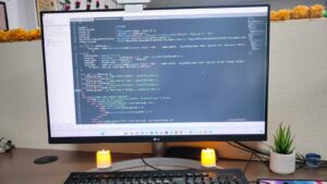 Computer monitor showing WordPress code on a desk